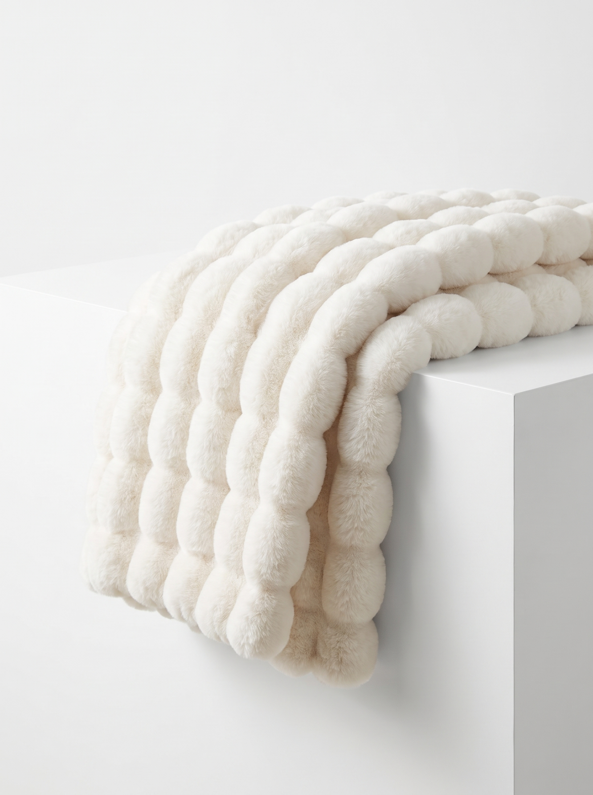 Mirren throw folded on white counter